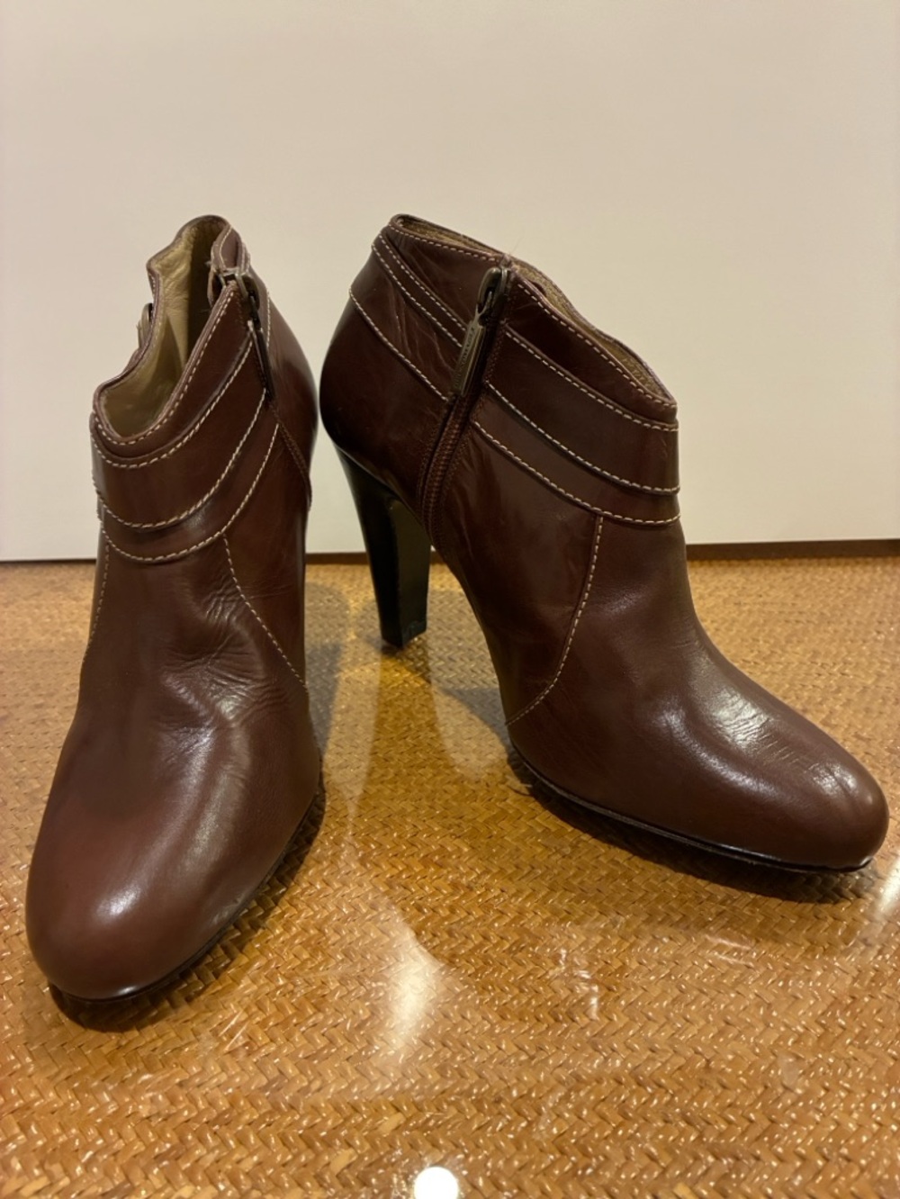Bruno Magli Campione leather ankle bootie with brass accents, inside zip. Sz37